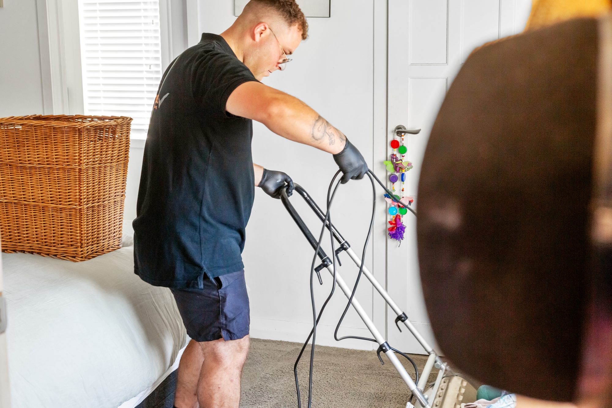 Carpet Lab technician cleaning residential carpet with professional extraction equipment